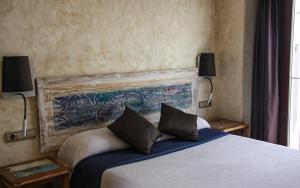 Łóżko lub łóżka w pokoju w obiekcie Room Tarifa