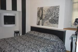 Voodi või voodid majutusasutuse Lori's Inn toas