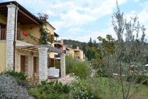 a view of a house with a garden at Alkyon Villas in Syvota