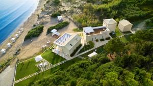 an aerial view of a house on a beach at Acantha Boutique Hotel in Ereikoússa