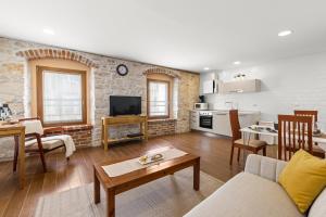 a living room with a couch and a table at NEW!!!Apartment Old Town Square in Poreč