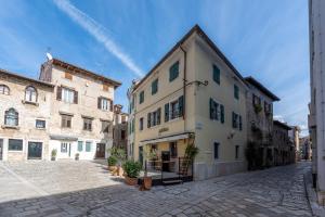 an alley in an old town with buildings at NEW!!!Apartment Old Town Square in Poreč