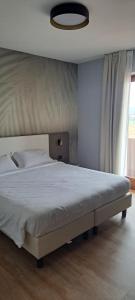Postel nebo postele na pokoji v ubytování Hotel B&B Fortuna