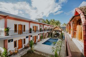 an exterior view of a house with a swimming pool at Garuda Dive & Accomodation Nusa Penida in Nusa Penida