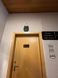 a door with a bat sign above it at Ferienhaus Löwenherz in Pommern