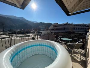 a hot tub on top of a building with a view at Premium Apartment in Fojnica