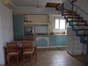 Η κουζίνα ή μικρή κουζίνα στο Nefeles Apartments