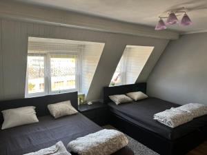 Posteľ alebo postele v izbe v ubytovaní NaturHouse Poznań