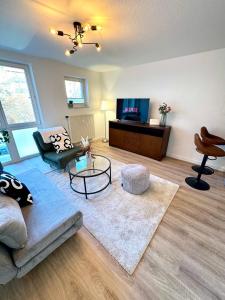 TV a/nebo společenská místnost v ubytování Ferienwohnung Markkleeberg Zentrum + 18 fotografií