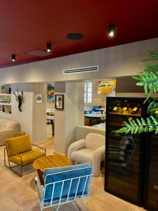 a store with chairs and tables in a room at LE CLOS DES ARÔMES in Cassis