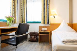Postel nebo postele na pokoji v ubytování Hotel Aulmann