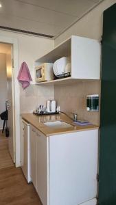 a kitchen with a sink and a counter top at Shoresh Green Hills in Shoresh