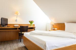 Postel nebo postele na pokoji v ubytování Hotel Aulmann
