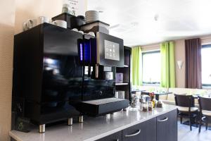 Kuchyň nebo kuchyňský kout v ubytování Hotel Aulmann
