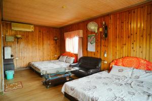 Una cama o camas en una habitación de Liu Fu Shan Zhuang