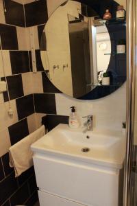a bathroom with a sink and a mirror at Sara in Višnjan +12 photos