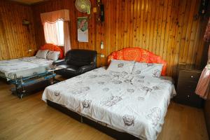 Una cama o camas en una habitación de Liu Fu Shan Zhuang