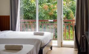 Postel nebo postele na pokoji v ubytování Paradise Hotel Hoi An