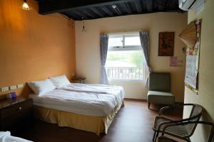 Una cama o camas en una habitación de Liu Fu Shan Zhuang
