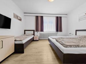 A bed or beds in a room at CityApt Wolfik Stockerau