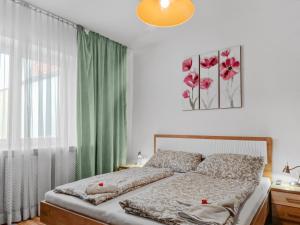 A bed or beds in a room at CityApt Wolfik Stockerau