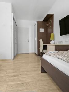 A bed or beds in a room at CityApt Wolfik Stockerau