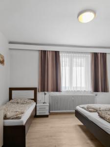 A bed or beds in a room at CityApt Wolfik Stockerau
