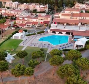 an aerial view of a resort with a swimming pool at Seaside in San Nicola Arcella! in Saracena