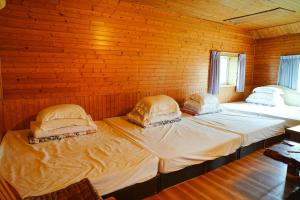 Una cama o camas en una habitación de Liu Fu Shan Zhuang