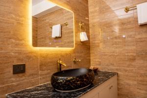Koupelna v ubytování Mhendo Hotel & Studio Suites