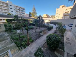 an aerial view of a courtyard with trees and buildings at Vida Rooms in Trapani