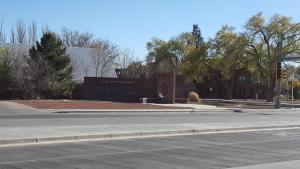 an empty street in front of a building at Sands Motel in Portales