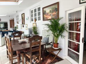 a dining room with a table and chairs at Spring Valley Farm in Quatford +17 photos