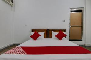Postel nebo postele na pokoji v ubytování Hotel O R S Guest House