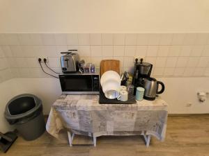 Příslušenství pro přípravu čaje a kávy v ubytování Business apartments "An der Lutherkirche" Self-Check-in