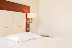 Posteľ alebo postele v izbe v ubytovaní Al Tezzon Hotel