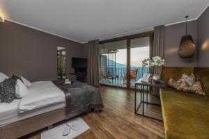 Postel nebo postele na pokoji v ubytování SOLEA SÜDTIROL Boutique Hotel