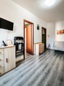 an empty room with a bed and a tv at Casale City in Casale Monferrato