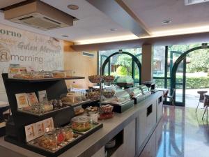 a buffet line with many different types of food at Hotel La Pergola in Grezzana