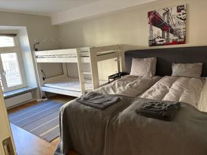 a bedroom with two beds and a bunk bed at CITY Centrum in Gothenburg