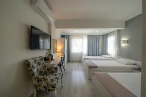 Postel nebo postele na pokoji v ubytování Artunc Hotel Bodrum + 37 fotografií