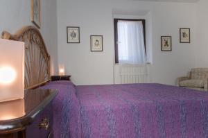 Postel nebo postele na pokoji v ubytování Podere i Giganti