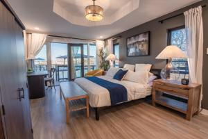a bedroom with a bed and a table with a desk at Happy Waves in New Braunfels