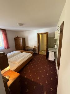 Voodi või voodid majutusasutuse Pension Plattenhof toas