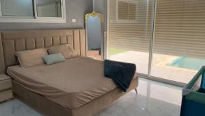Ένα ή περισσότερα κρεβάτια σε δωμάτιο στο Villa Mykonos sans vis a vis