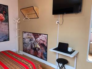 Μια τηλεόραση ή/και κέντρο ψυχαγωγίας στο Ma maison peruvienne- departamento muy cerca aéropuerto