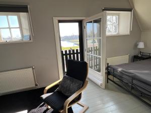 Postel nebo postele na pokoji v ubytování het Binnenhuis