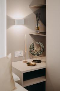 a room with a bed and a table with a candle at Apartment eVaLa in Split +51 photos