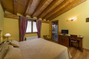 Postel nebo postele na pokoji v ubytování Agriturismo Vigneto Vecio