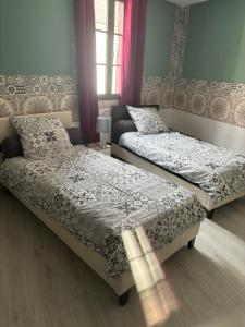 Ένα ή περισσότερα κρεβάτια σε δωμάτιο στο Gîte Arcis sur Aube